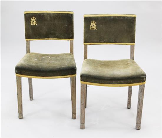 A pair of Elizabeth II limed oak coronation chairs,